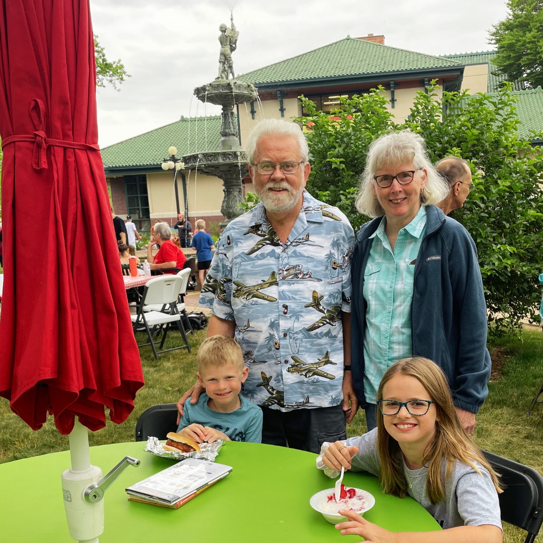 Grandparents and grandchildren in the library park