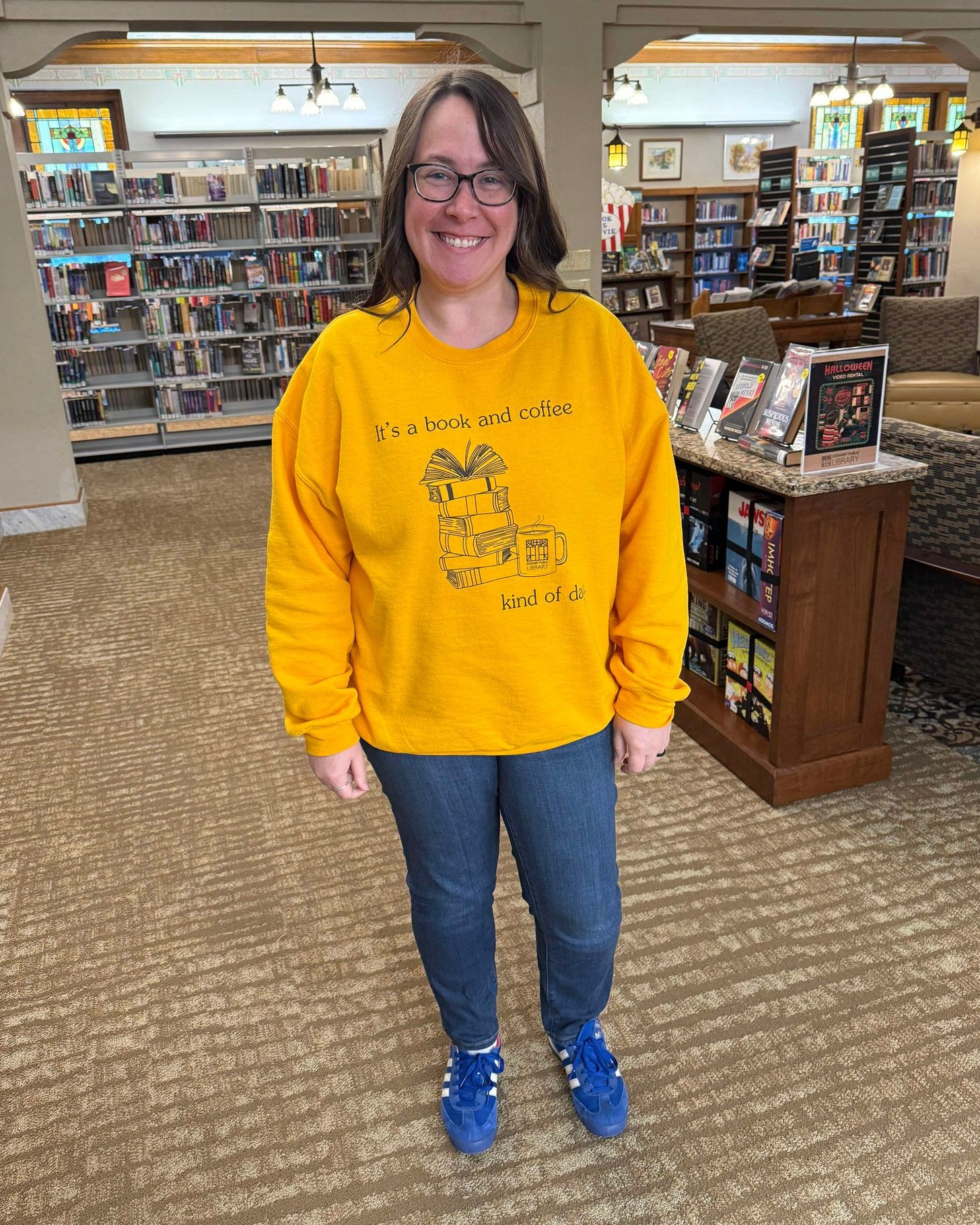 Library staff member wearing a library shirt